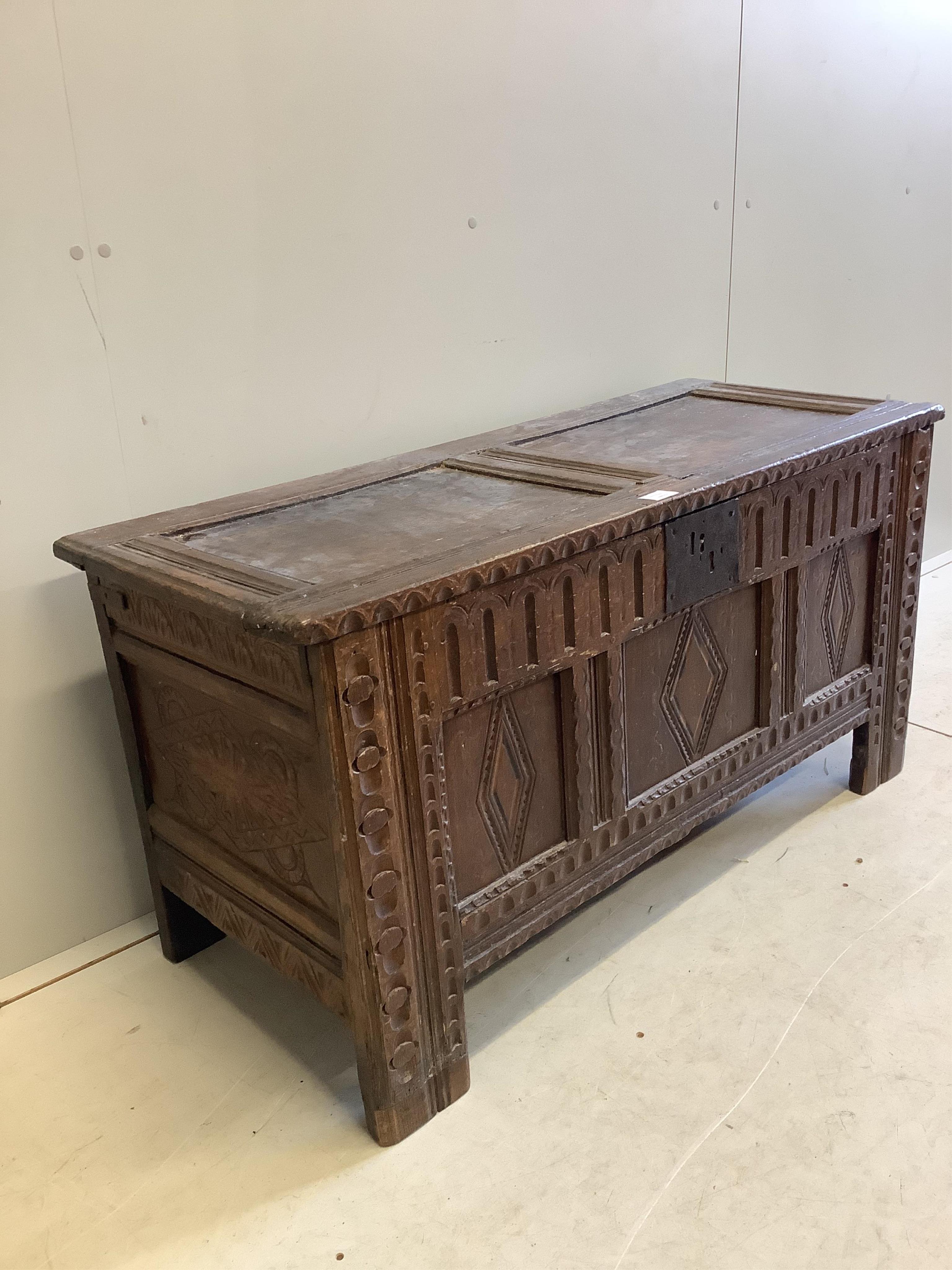 A 17th century and later carved oak coffer, width 118cm, depth 48cm, height 61cm. Condition - fair